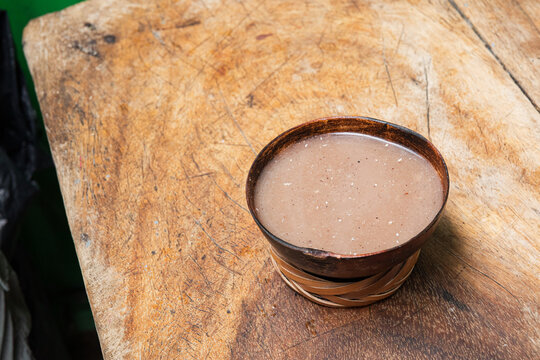 Traditional cacao beverage served in a rustic bowl