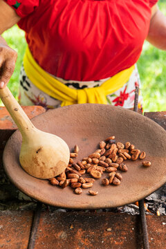 Women Roasting Cacao Beans with Traditional Methods
