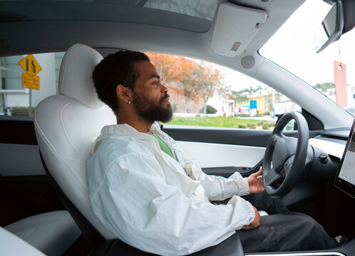 Man drives EV in the city
