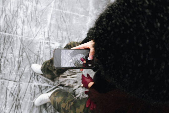 Legs of girl, weared in white ice skates