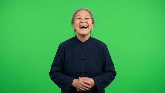 Happy Senior Asian Woman Laughing Heartily in Traditional Outfit for Chinese New Year, Cultural Diversity, and Aging Concept Videos