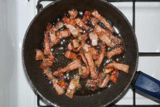Bacon frying on a pan