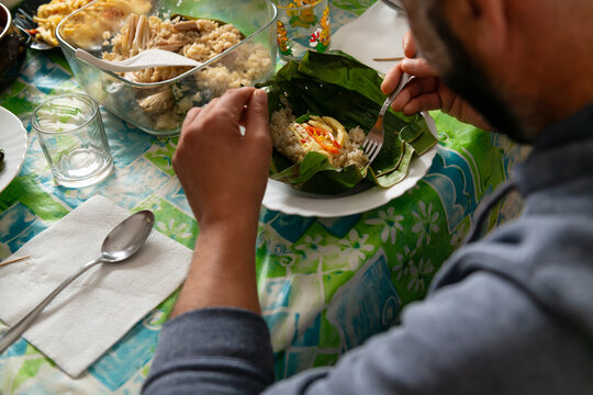 Man enjoying a traditional Indonesian meal
