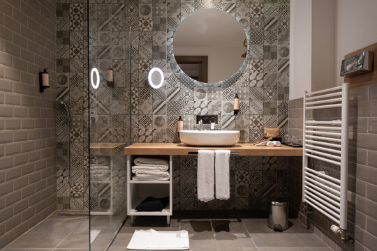 Modern Luxury Hotel Bathroom with Round Mirror