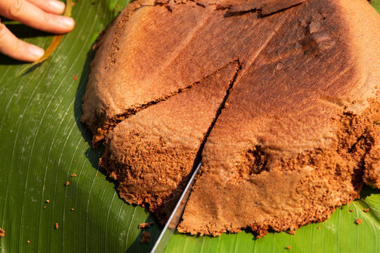 Cutting a cacao handmade cake