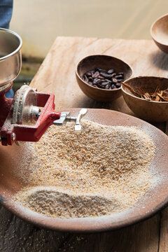 Corn powder Being Processed with a Hand Mill