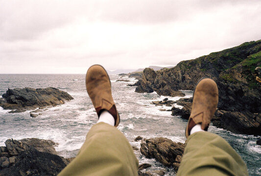 Dangling feet above the sea