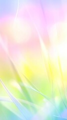 Fototapeta premium Dreamy pastel background with bokeh and soft focus grass blades, evoking a sense of serenity and gentle light