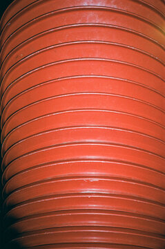 Stacked Red Plastic Chairs