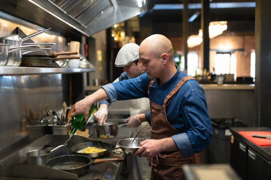 Male cooks working in cafeteria