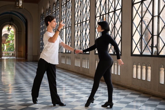 Couple dancing in ballroom together
