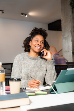 Positive woman talking phone 