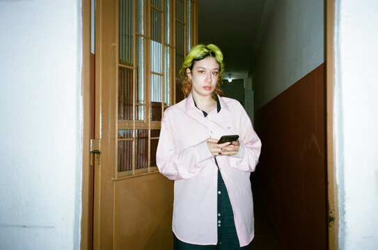 Portrait of a person holding phone
