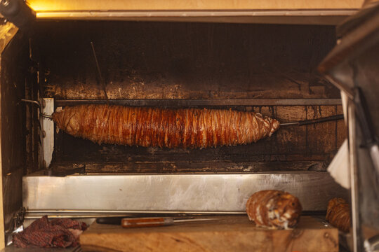 Traditional kokorec roasting on a spit