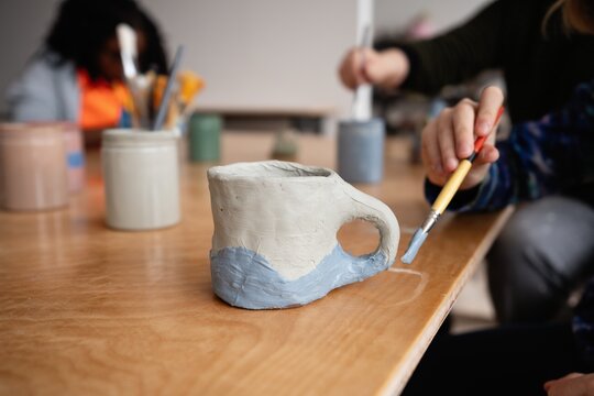 Child Painting Clay Mug
