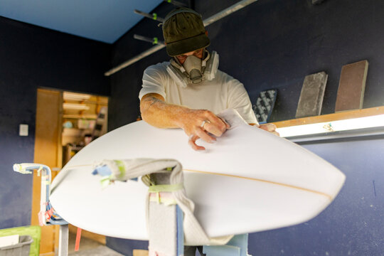 surfboard shaper finishing blank in Australia