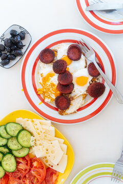 Breakfast plate with fried eggs and sausage