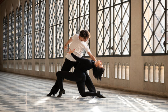 Male dancer tilting partner back