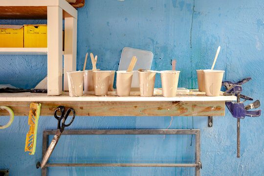 Resin mixing shelf in surfboard workshop in Australia