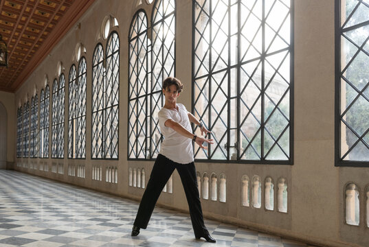 Graceful male dancing in ballroom