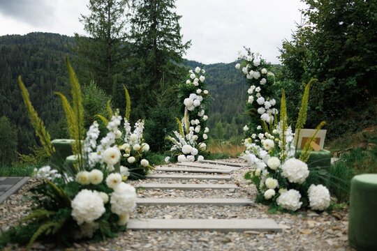 Decorative path between flowers with wonderful view in high mountains