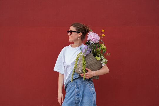 Flower Seller with a Basket of Flowers