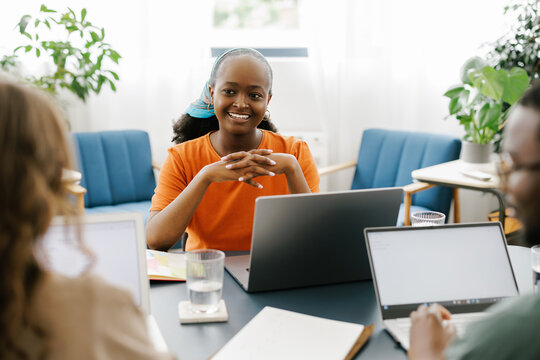 Group of People Having a Discussion in a Workspace Setting