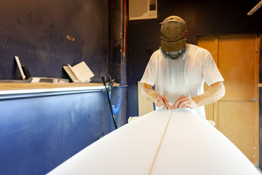 Surfboard shaper planing stringer 
