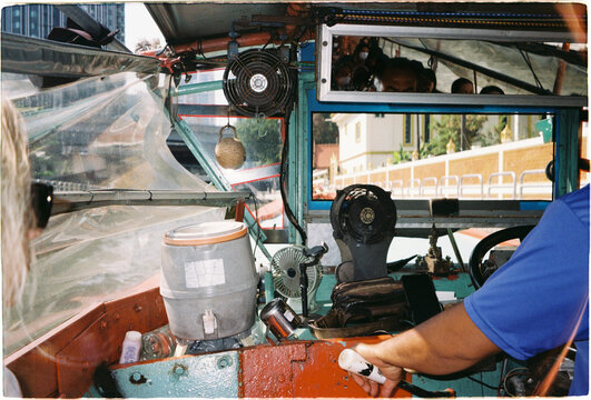 Boat ride through the city, showing the driver and controls