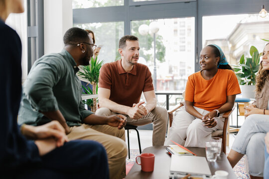 Group of People Having a Discussion in a Modern Office Space