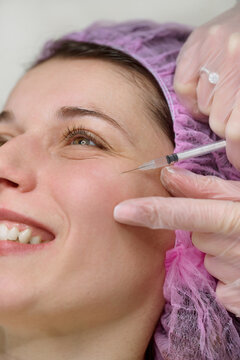 Cosmetic injections in forehead at beauty clinic