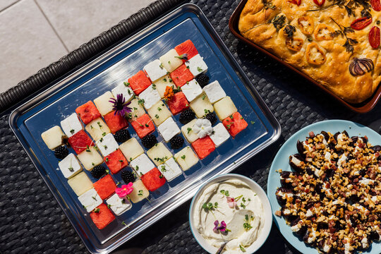 Square fruits arrangement with snack food overhead shot