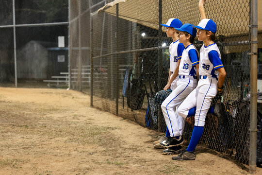 Baseball Team Awaits Turn at Night