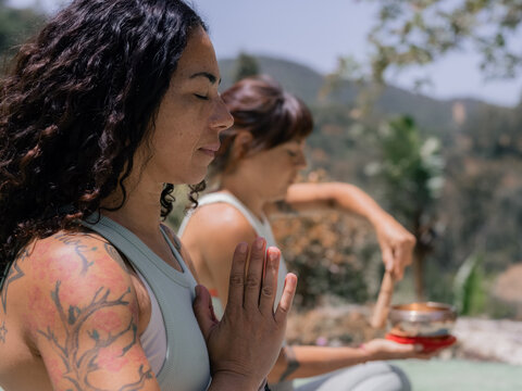 Closeup of meditating women 