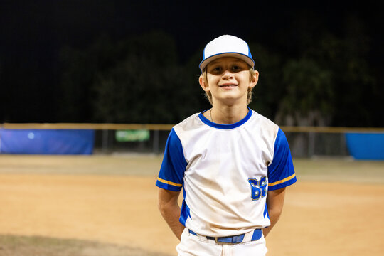 Young Player Poses for Portrait at Baseball Field