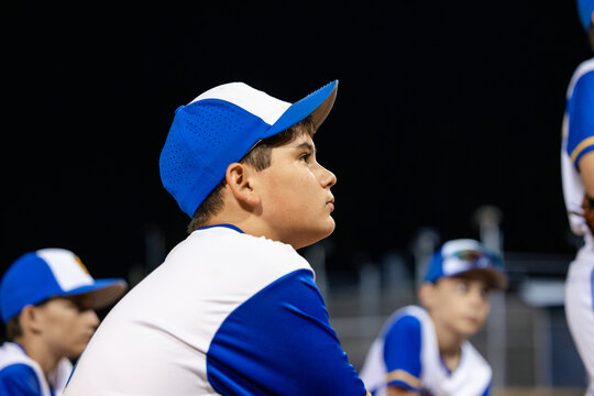 Young Baseball Team Trains Under Night Sky