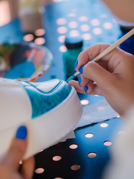 Designer painting on shoes 