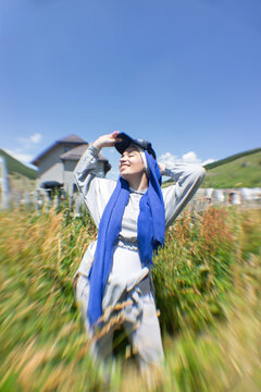 Woman Enjoying a Sunny Day in the Countryside