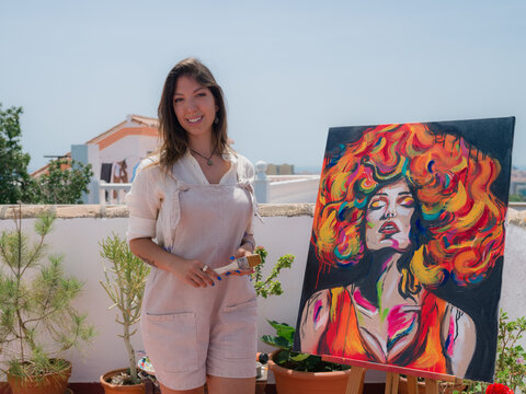 Portrait of painter near artwork 
