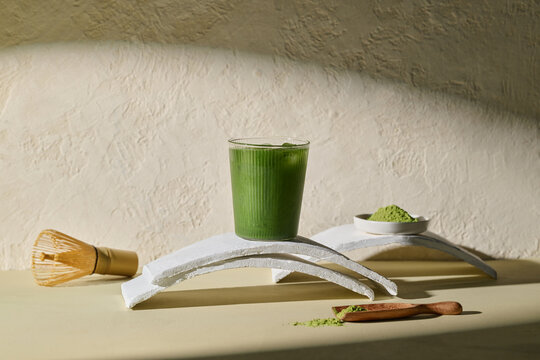 Refreshing Green Matcha Iced Drink With Bamboo Whisk and Powder