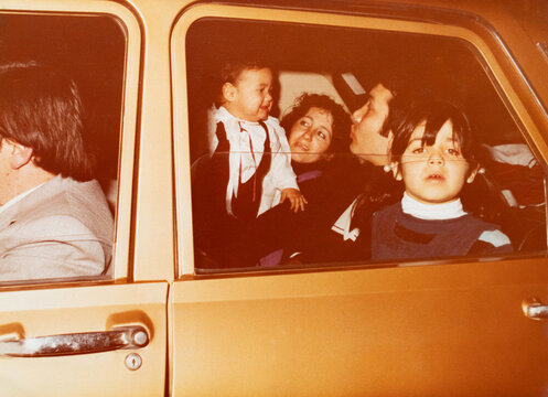 Family traveling in car, capturing 1980s childhood memories