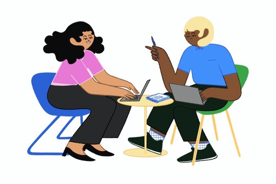 Coworkers Discussing Project with Laptops and Notepad