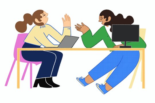 Two Women Coworkers Collaborating with Laptops