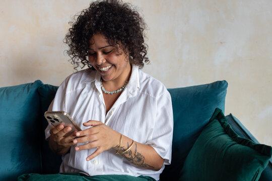 portrait of smiling woman using smartphone