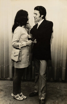 Vintage 1970s couple sharing an intimate moment