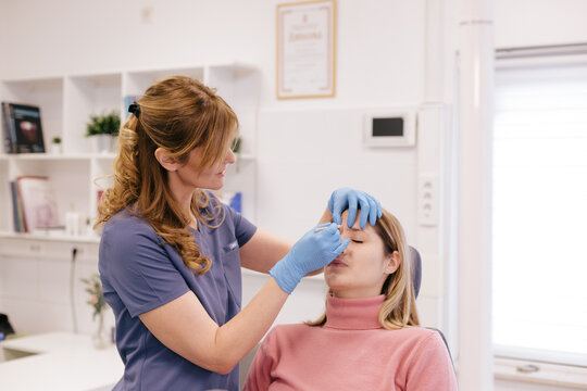 A doctor is examining the patient