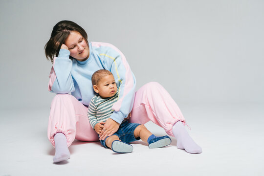 Mom and son on a white background in the studio.