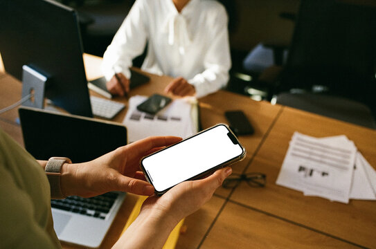 Colleague Using Smartphone with Blank Screen During Workday