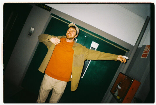 Man Posing In Corridor With Bandaged Finger Film