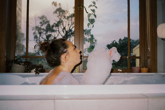 Woman in a bubble bath, shot on film 